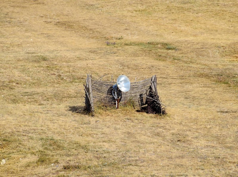 Lamp with a searchlight on the lawn for lighting a high object. Taman, Krasnodar Krai, Russia