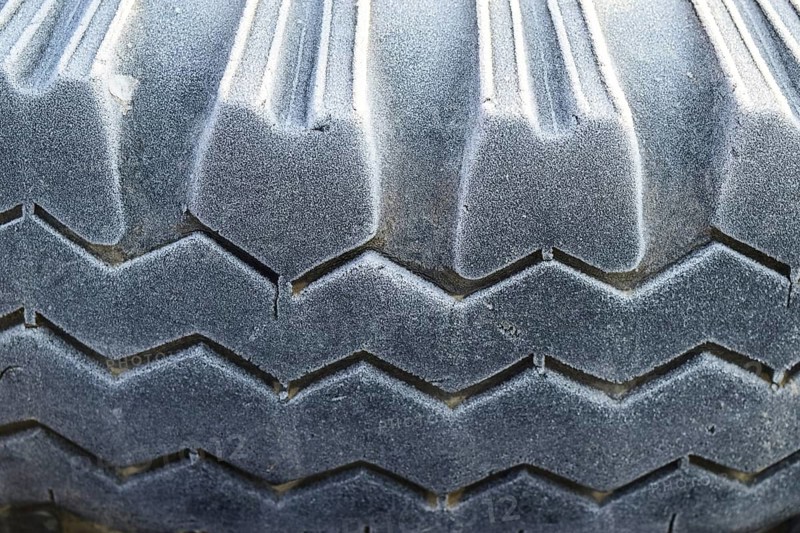 Hoarfrost on a rubber tire wheel. Krasnodar, Russia