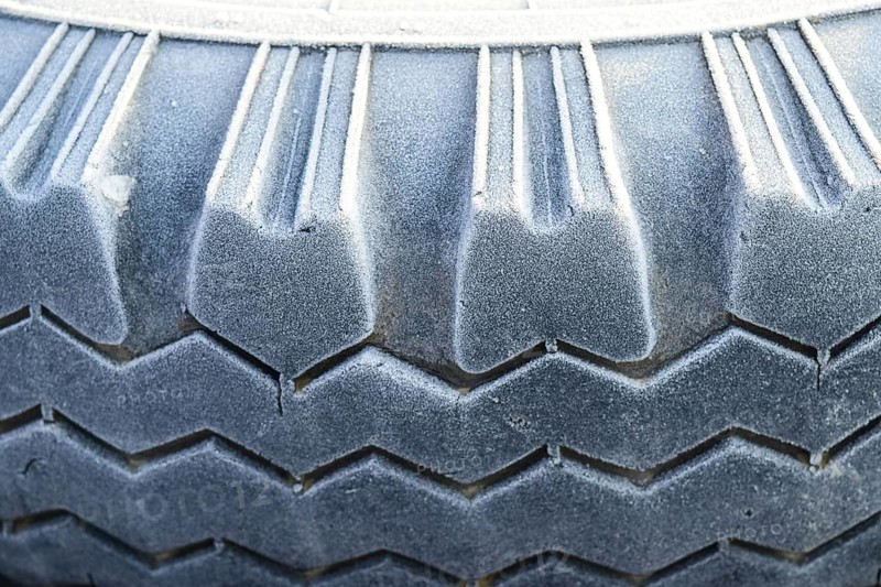 Hoarfrost on a rubber tire wheel. Krasnodar, Russia