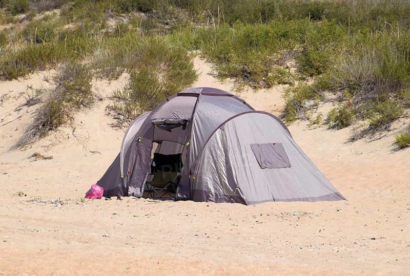 Tourist tent on the sand. Parking of tourists on the sandy beach. Golubitskaya, Russia