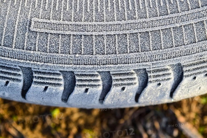 Hoarfrost on a rubber tire wheel. Krasnodar, Russia