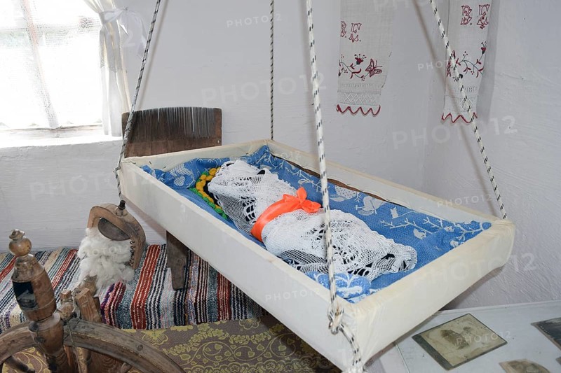 Cradle with dolls in the bedroom. Taman, Krasnodar Krai, Russia