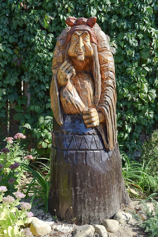 The wooden statue of Baba Yaga in a mortar. Taman, Krasnodar Krai, Russia