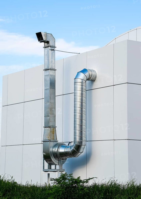 Ventilation hood with a pipe behind the cafe building. Atyrau, Kazakhstan