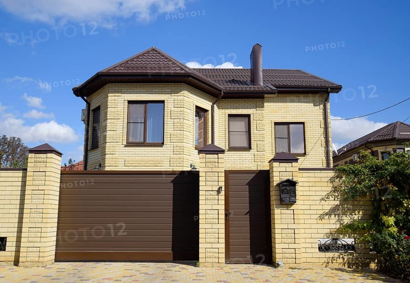 Decorative metal on the roof of a brick house. Atyrau, Kazakhstan