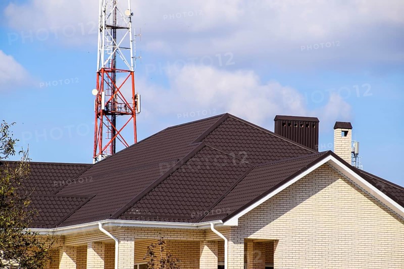 Decorative metal tile on a roof. Atyrau, Kazakhstan