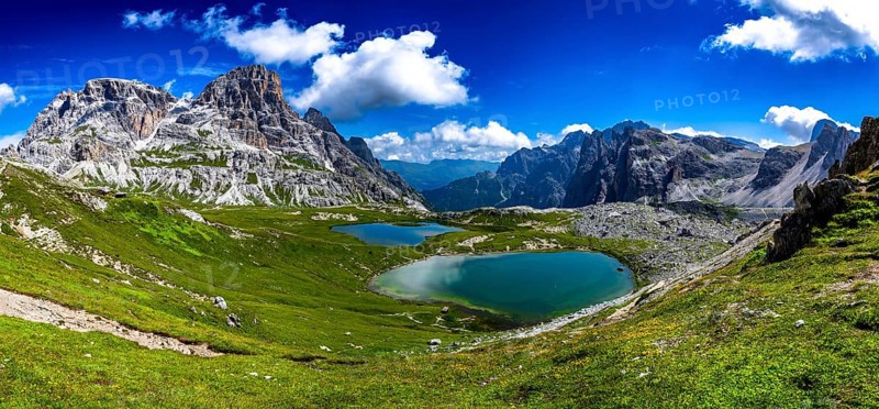 Alpine Landscape With Mountain Peaks And Clear Lakes At The Formation Tre Cime Di Lavaredo In The Dolomites Of South Tyrol In Italy