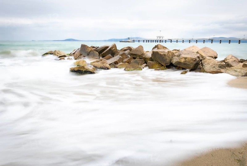 Long exposure of Seashore in Burgas city with Burgas bridge in the background. Bulgaria