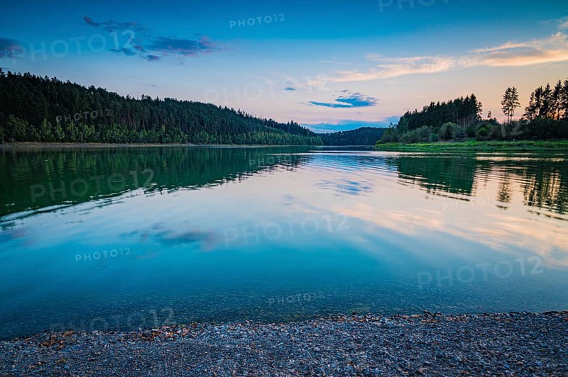 Reflecting water in the reservoir against an evening forest backdrop and a peaceful atmosphere, Zeulenrodaer Meer reservoir, Zeulenroda-Triebes, Thuringia, Germany