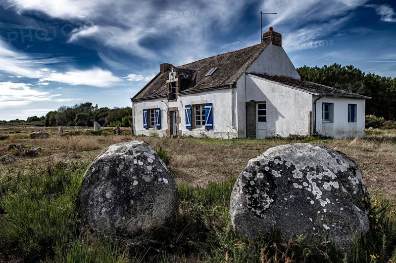 Ancient Stone Field Alignements De Menhir Carnac With Neolithic Megaliths And Old Cottage In Brittany, France