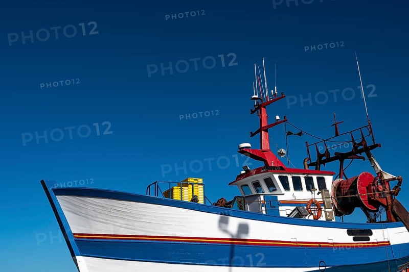 Fishing Boat In The Harbor Docks Of Finistere City Guilvinec At The Coast Of Atlantic In Brittany, France