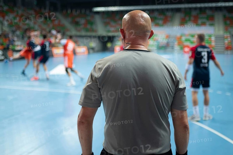 Referee's back during handball match. Lubin, Poland