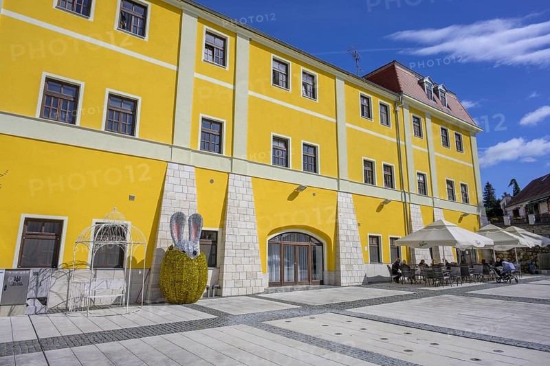 Square in front of old house with café and glittering Easter bunny figure, Varaždinske toplice, Varaždin County, Croatia