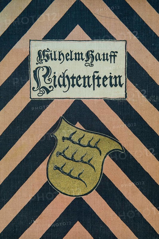 Book title, cover, book binding textile, novel, Lichtenstein by Wilhelm Hauff, publisher Abel und Müller, Leipzig, publisher dissolved in 1983, coat of arms of Württemberg, coat of arms of the ruler and state, script, letters, history of Baden-Württemberg, literature, studio, Germany