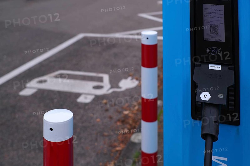 Car park with petrol pump, EnBW charging station for electric cars, electric filling station, e-filling station, e-mobility, empty, free, unused, without e-car, pictogram, logo, Stuttgart, Baden-Württemberg, Germany