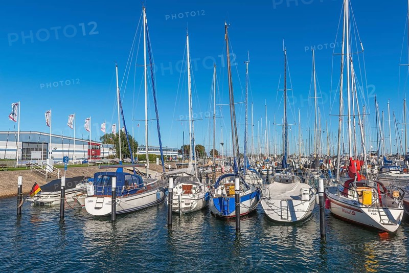 Strande marina near Kiel, Rendsburg-Eckernförde district, ship masts, water reflection, dolphins, Baltic Sea, sailing, leisure activities, water sports, summer, blue sky, sunshine, Bay of Kiel, Schleswig-Holstein, Germany