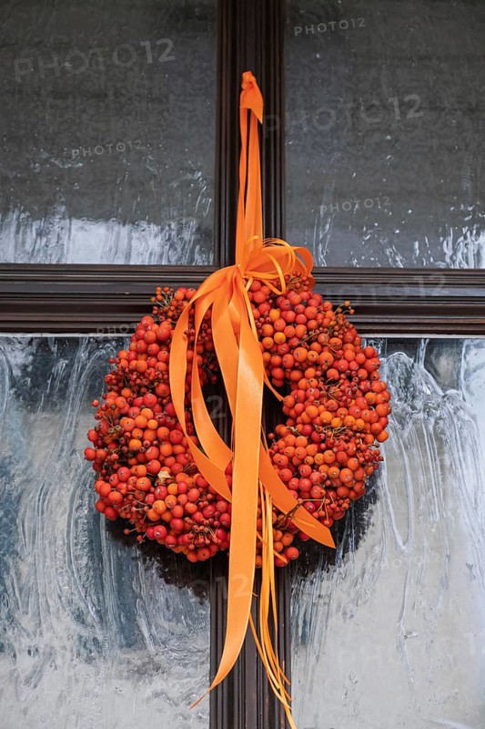 Door wreath made from orange rowanberries, Hesse, Germany
