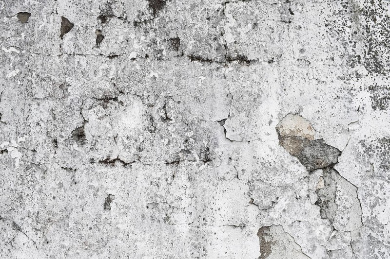 Weathered grey wall with cracks and visible texture, Hesse, Germany