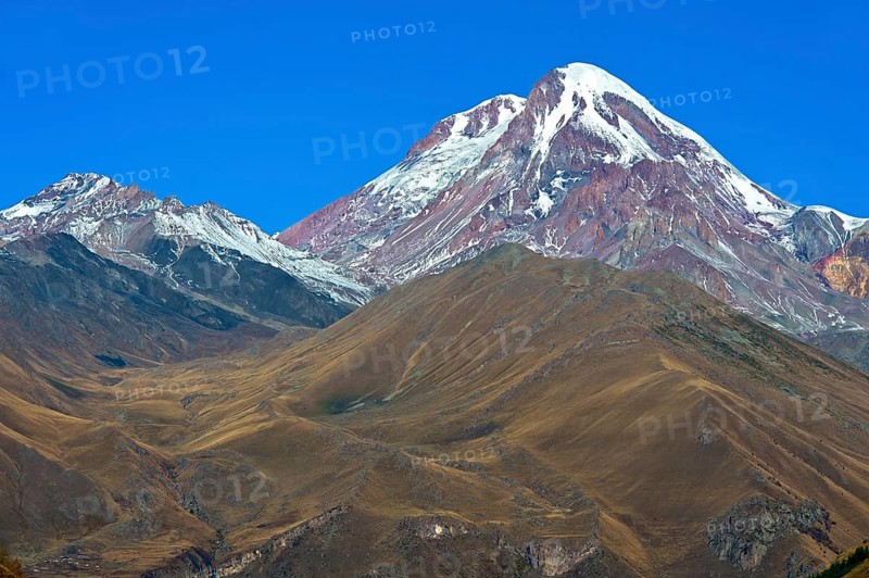 The snow and ice-covered peak of Kazbek, Stepantsminda, Georgia