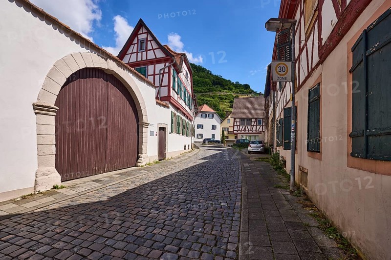 Old town, alley, cobblestone pavement, historic half-timbered houses, wall, access gate, blue sky, cumulus clouds, Starkenburgweg, Heppenheim, Odenwald, Bergstrasse district, Hesse, Germany