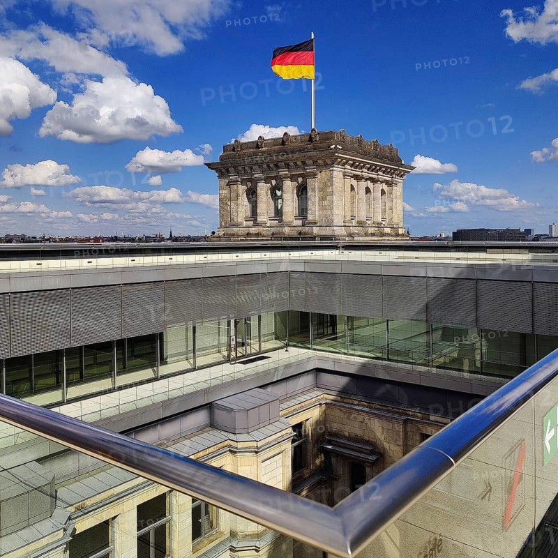 Viewing platform with a German flag in the wind on one of the corner towers and a view of an inner courtyard, government district, Berlin, Germany