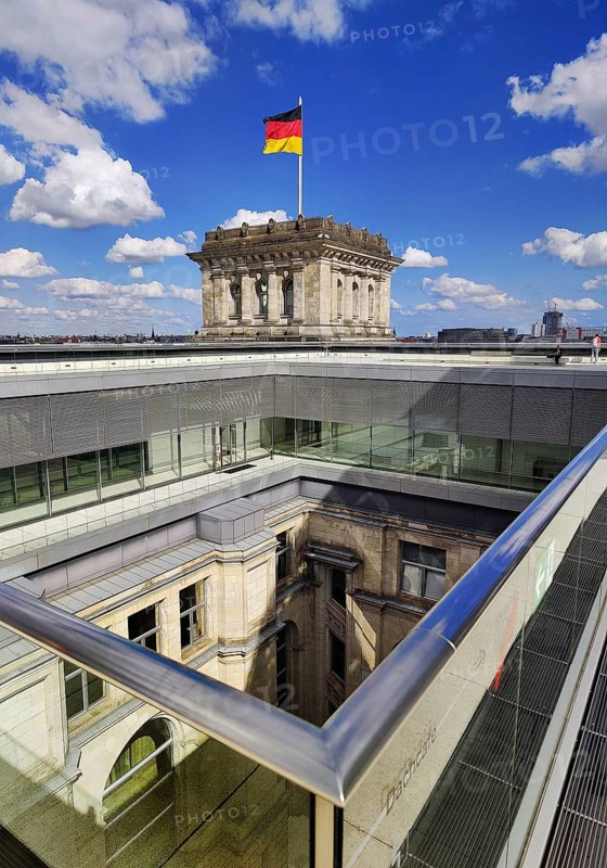 Viewing platform with a German flag in the wind on one of the corner towers and a view of an inner courtyard, government district, Berlin, Germany