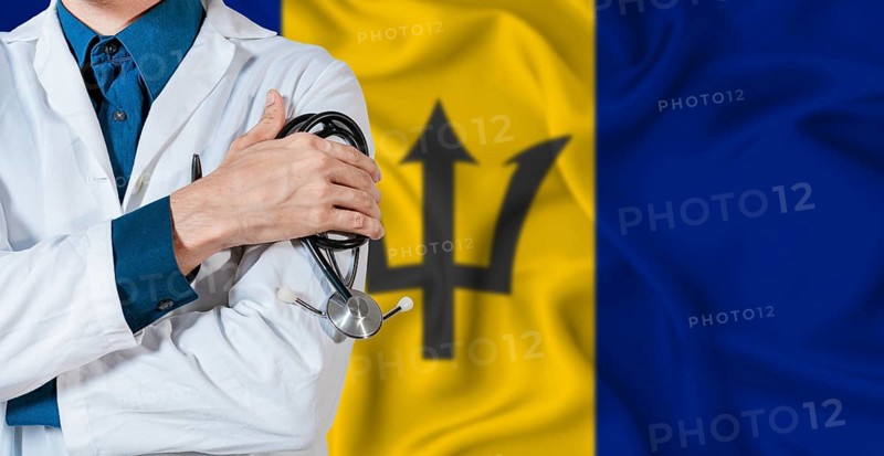 Barbados healthcare concept. Doctor with stethoscope on Barbados flag. Doctor holding stethoscope on Barbadian flag