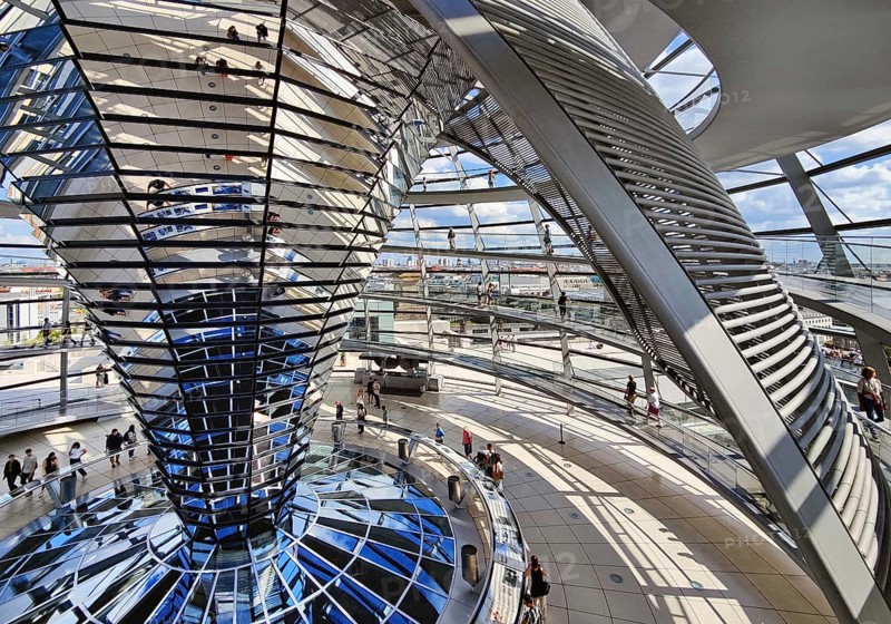 Interior view of the Reichstag dome with the mirror cone, sun protection element and visitors, Reichstag building, government district, Berlin, Germany