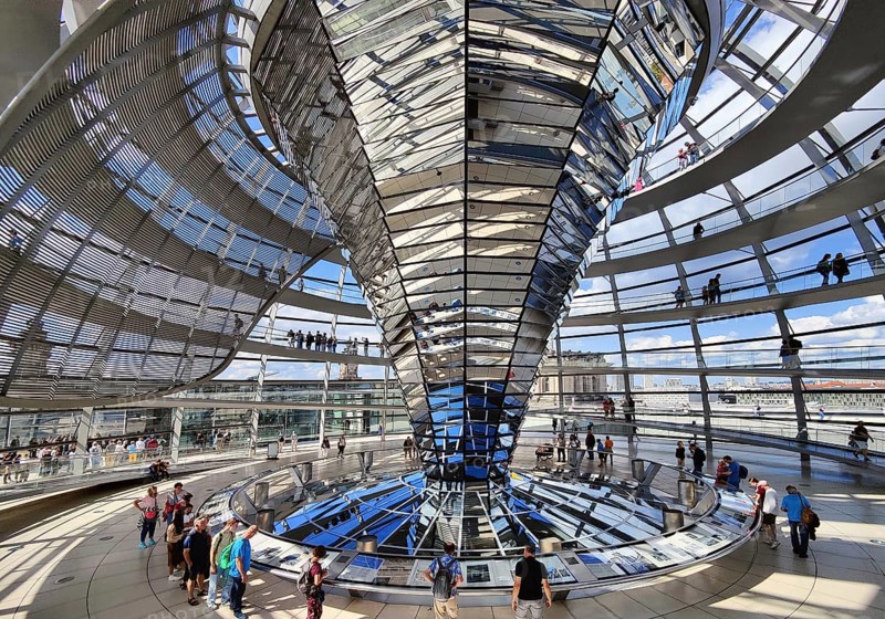 Interior view of the Reichstag dome with the mirror cone and visitors, Reichstag building, government district, Berlin, Germany