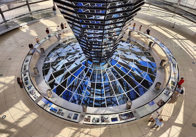 Reichstag dome, interior view from top to bottom of the mirror cone with visitors, Reichstag building, government district, Berlin, Germany