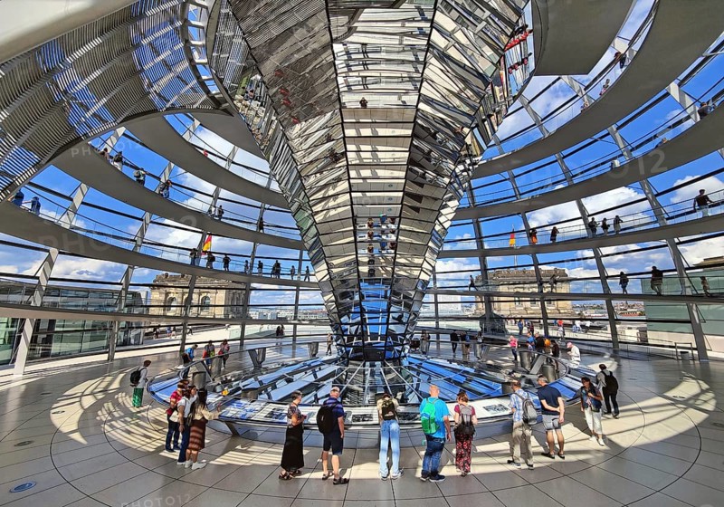 Interior view of the Reichstag dome with the mirror cone and visitors, Reichstag building, government district, Berlin, Germany