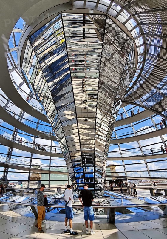 Interior view of the Reichstag dome with the mirror cone and visitors, Reichstag building, government district, Berlin, Germany