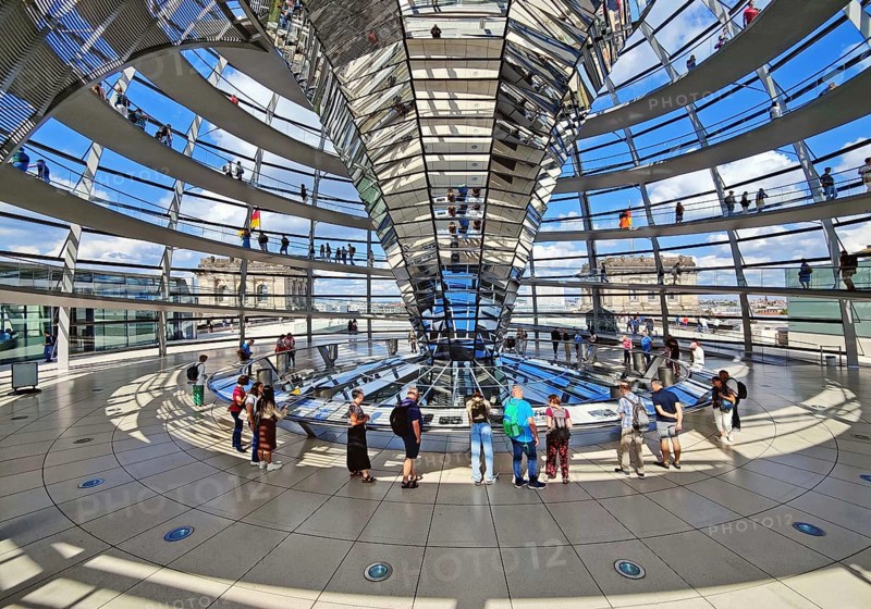 Interior view of the Reichstag dome with the mirror cone and visitors, Reichstag building, government district, Berlin, Germany