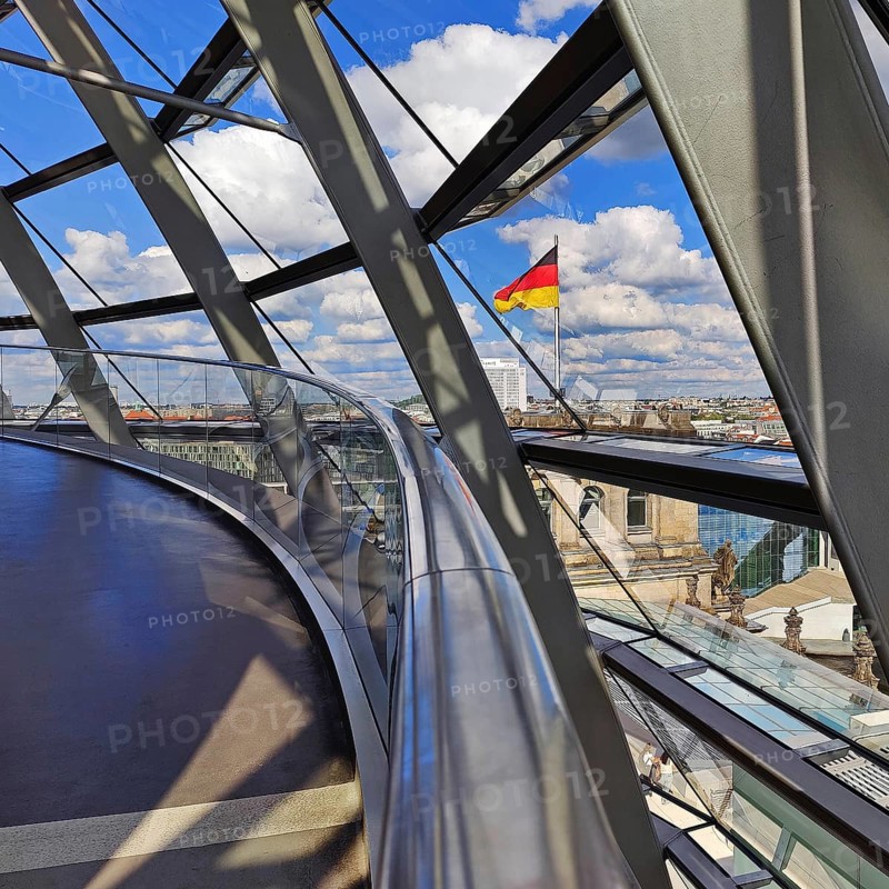 Interior view of the Reichstag dome with a view of a German flag without people, Reichstag building, government district, Berlin, Germany