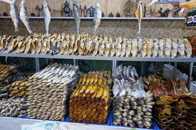 Different types of fish are neatly stacked on a shelf in a fish market, fish sale, Tsovagyugh, Lake Sevan, Gegharkunik province, Armenia