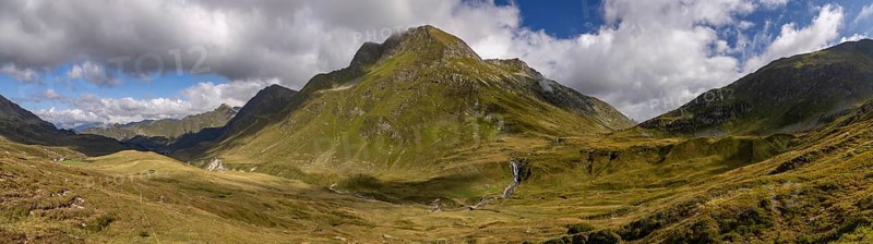 View from Passo del Sole to Passo dell'Uomo with waterfall, Alpe Carorescio with Piano Grande plateau, Quinto, Ticino, Switzerland