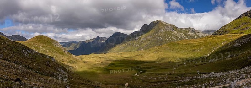 Panorama from Passo del Sole to Passo dell'Uomo and Alpe Carorescio with Piano Grande plateau, Quinto, Ticino, Switzerland