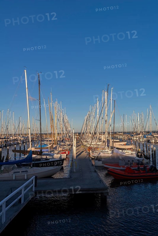 Olympic harbour Schilksee, Olympic Games 1972, sailing yachts at the jetty, ship masts in a row, evening light, sunshine, blue sky, Baltic Sea, Kiel Bay, Kiel Sailing City, Schleswig-Holstein, Germany