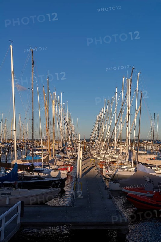 Olympic harbour Schilksee, Olympic Games 1972, sailing yachts at the jetty, ship masts in a row, evening light, sunshine, blue sky, Baltic Sea, Kiel Bay, Kiel Sailing City, Schleswig-Holstein, Germany