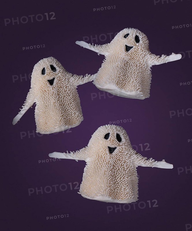 Three funny ghosts are flying on a purple background