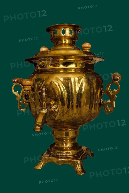 A 19th-century brass samovar, isolated on a green background, Russia