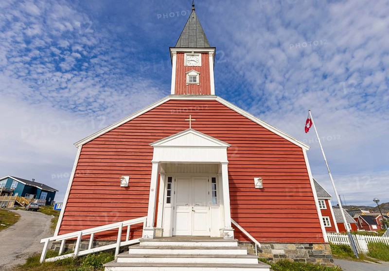 Panoramic view of Greenland capital Nuuk with church and colored houses located near fjords and icebergs