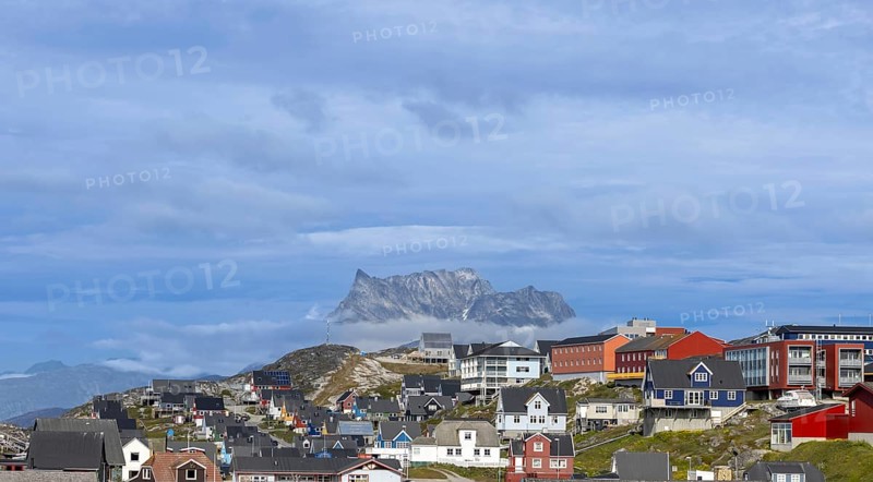Panoramic view of Greenland capital Nuuk with colored houses located near fjords and icebergs