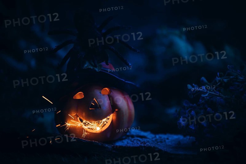 Glowing pumpkin with spider and sparks, dark, spooky, Halloween