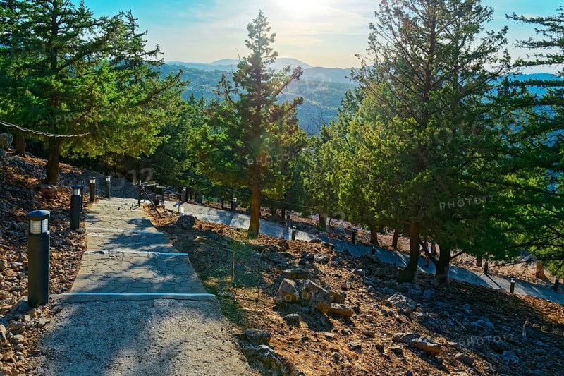 Path with over 300 steps to the chapel of the Virgin Mary Tsambika (Kyra Psili) in a sunny mountain landscape with views of forests and the distance, Church of the Virgin Mary Tsambika (Kyra Psili), Archangelos, Rhodes Island, Greece