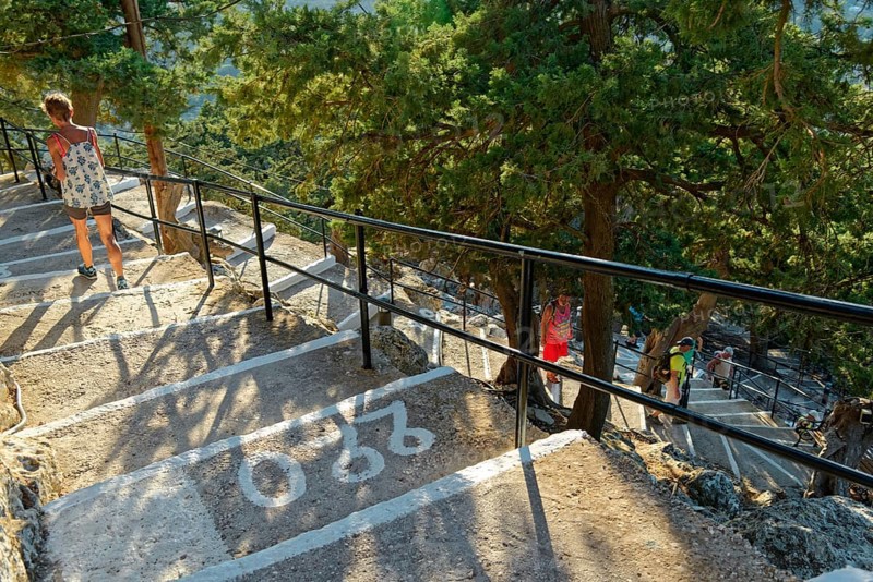 Path with over 300 steps to the Chapel of the Virgin Mary Tsambika (Kyra Psili), surrounded by trees and sunshine, Church of the Virgin Mary Tsambika (Kyra Psili), Archangelos, Rhodes Island, Greece