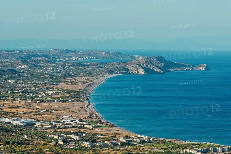 Wide coastline of Kolymbia with sandy beach and blue sea under a clear sky, Church of the Virgin Mary Tsambika (Kyra Psili), Archangelos, Rhodes Island, Greece