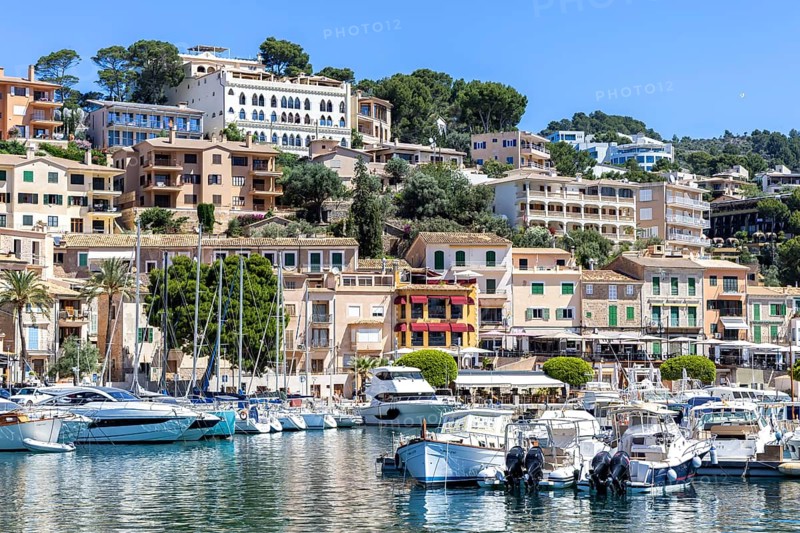 Port de Soller town on Majorca holiday by the sea yacht harbour with boats trip in Port de Sóller, Spain