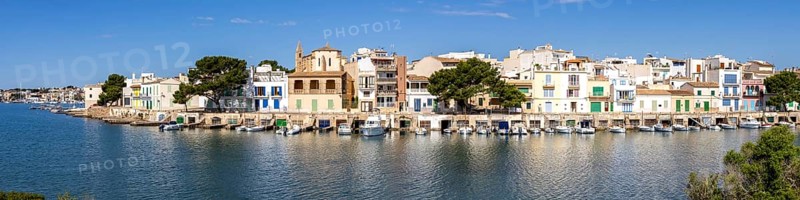 Colourful houses in Portocolom Fishing village on Majorca Panorama with boats Holiday by the sea Trip to Portocolom, Spain