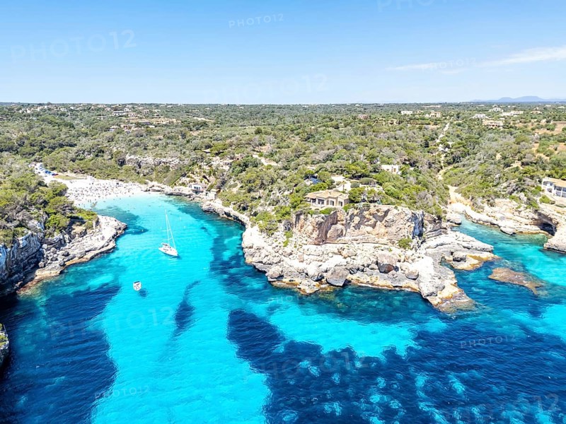 Aerial view of Cala Llombards beach on the island of Majorca from above in the Mediterranean Sea travelling in Cala Llombards, Spain
